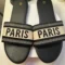 Women's Paris slide sandals with black embroidered jacquard strap and black cushioned footbed