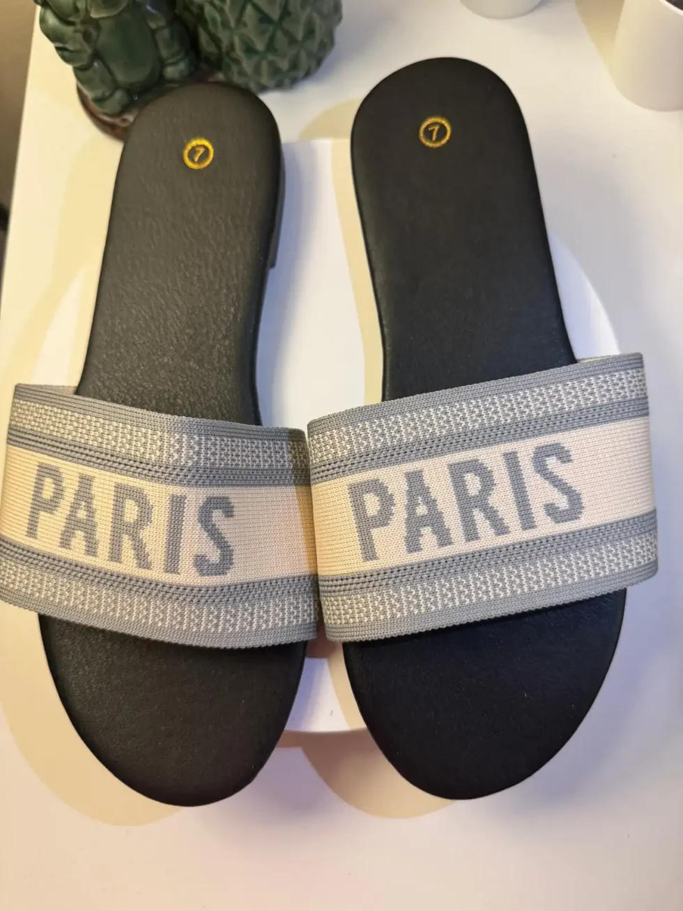 Women's Paris slide sandals with grey and cream embroidered jacquard strap and black cushioned footbed